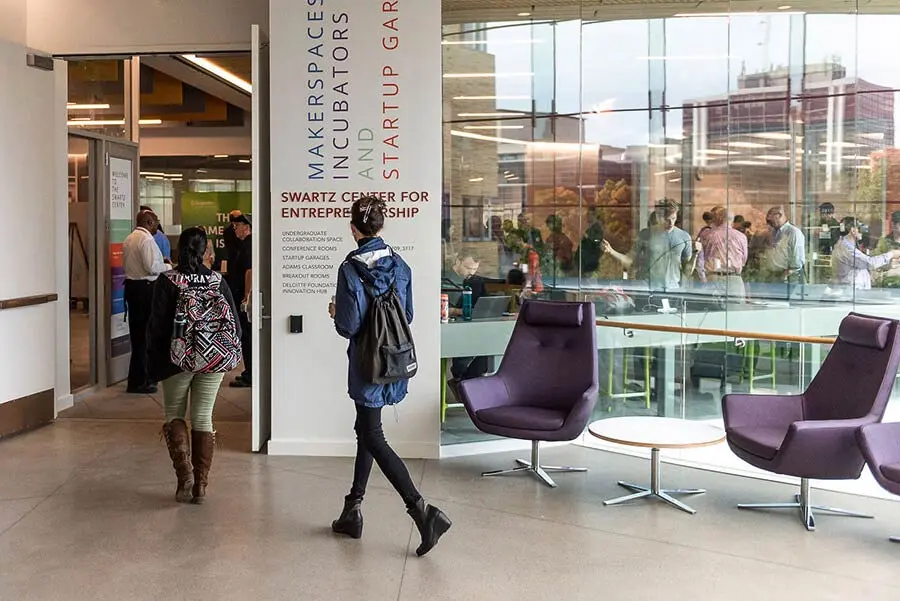 A student walking into the Swartz Center